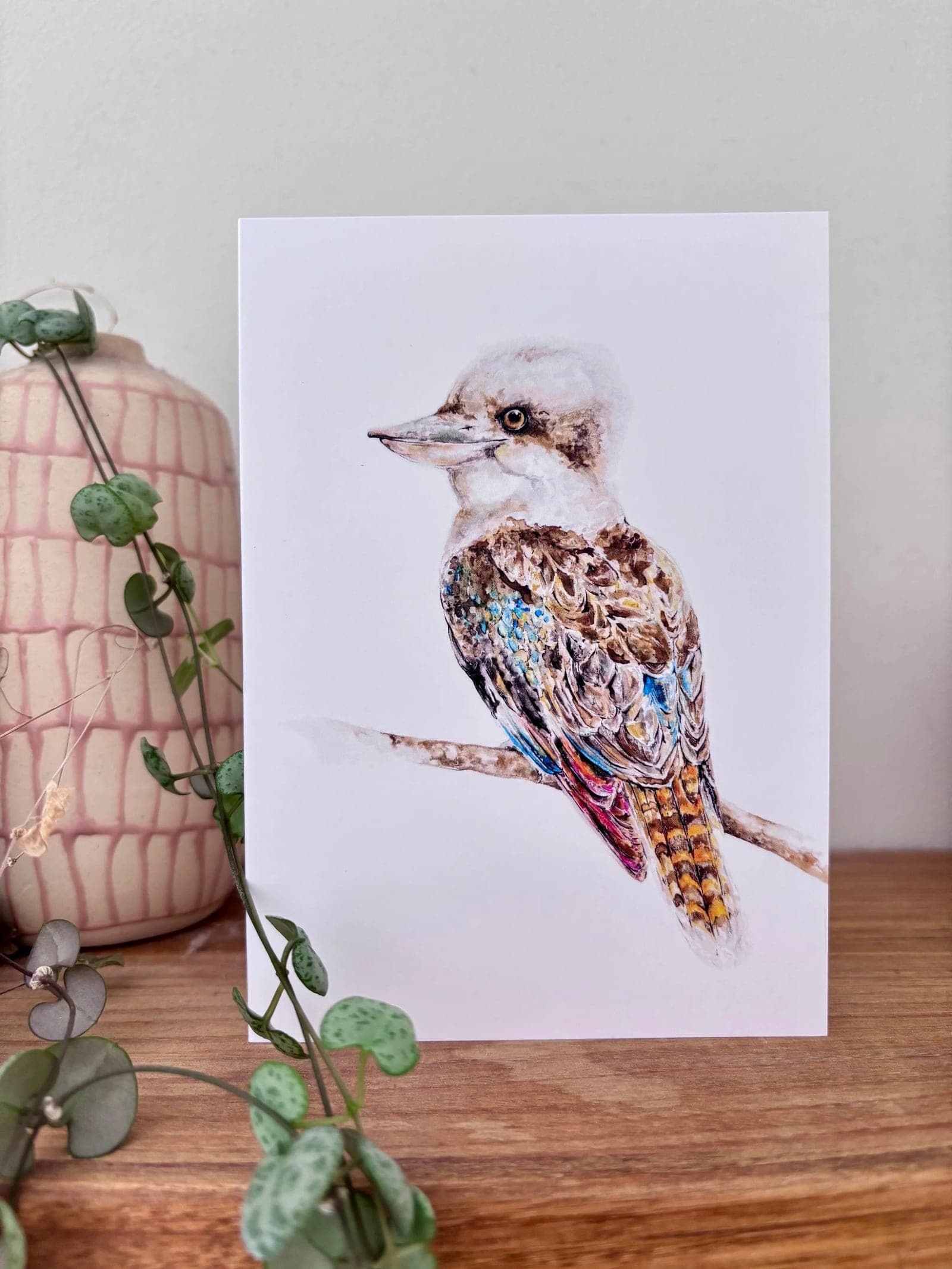Kookaburra greeting card propped against a vase