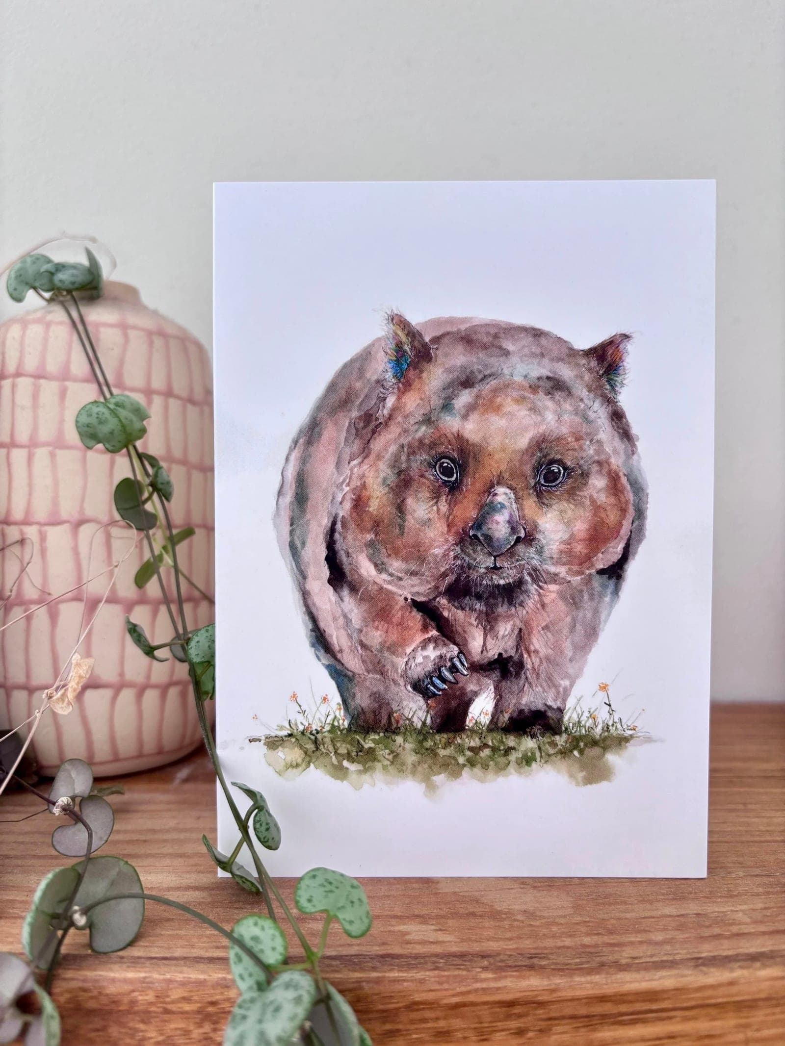 Wombat greeting card styled on a timber surface